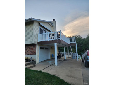 Welcome to this charming 3-bedroom, 3-bath split foyer home on Terre Du Lac Golf and Country Club in Missouri - for sale on GolfHomes.com, golf home, golf lot