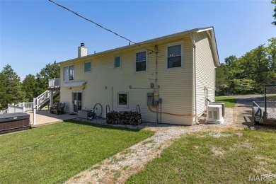 Welcome to this charming 3-bedroom, 3-bath split foyer home on Terre Du Lac Golf and Country Club in Missouri - for sale on GolfHomes.com, golf home, golf lot