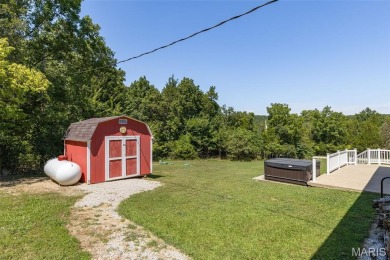 Welcome to this charming 3-bedroom, 3-bath split foyer home on Terre Du Lac Golf and Country Club in Missouri - for sale on GolfHomes.com, golf home, golf lot