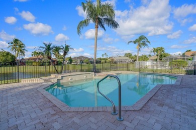 This former model home offers breathtaking lake and golf course on The Wanderers Club in Florida - for sale on GolfHomes.com, golf home, golf lot