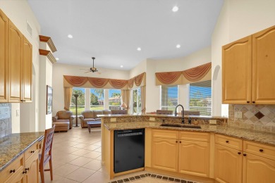 This former model home offers breathtaking lake and golf course on The Wanderers Club in Florida - for sale on GolfHomes.com, golf home, golf lot