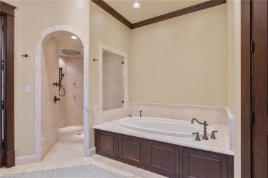 Welcome to this stunning 4-bedroom, 5.5-bathroom retreat nestled on The Traditions Club At Texas A and M in Texas - for sale on GolfHomes.com, golf home, golf lot