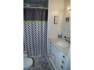 This move-in ready home, located along the tranquil perimeter of on Six Lakes Country Club in Florida - for sale on GolfHomes.com, golf home, golf lot