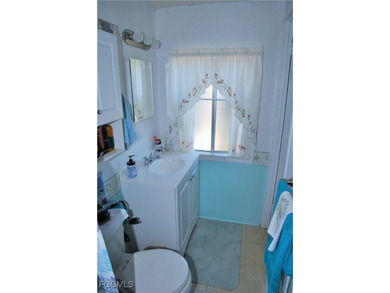 This move-in ready home, located along the tranquil perimeter of on Six Lakes Country Club in Florida - for sale on GolfHomes.com, golf home, golf lot