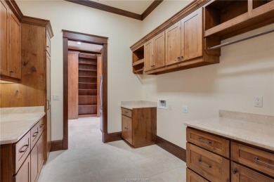 Welcome to this stunning 4-bedroom, 5.5-bathroom retreat nestled on The Traditions Club At Texas A and M in Texas - for sale on GolfHomes.com, golf home, golf lot