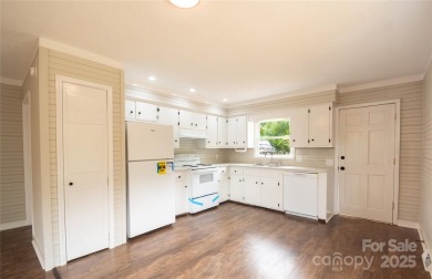 Updated water view home with a full basement, located less than on Piney Point Golf Club in North Carolina - for sale on GolfHomes.com, golf home, golf lot