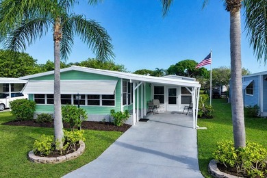 Live the vacation every single day in vibrant Barefoot Bay! This on Barefoot Bay Golf Course in Florida - for sale on GolfHomes.com, golf home, golf lot