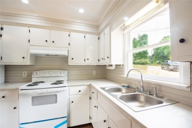 Updated water view home with a full basement, located less than on Piney Point Golf Club in North Carolina - for sale on GolfHomes.com, golf home, golf lot