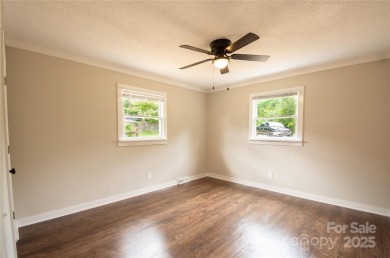 Updated water view home with a full basement, located less than on Piney Point Golf Club in North Carolina - for sale on GolfHomes.com, golf home, golf lot