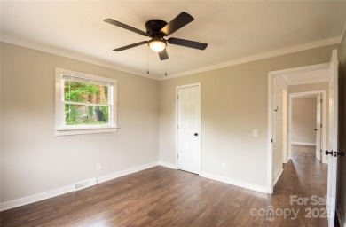 Updated water view home with a full basement, located less than on Piney Point Golf Club in North Carolina - for sale on GolfHomes.com, golf home, golf lot