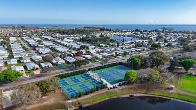 Live the vacation every single day in vibrant Barefoot Bay! This on Barefoot Bay Golf Course in Florida - for sale on GolfHomes.com, golf home, golf lot