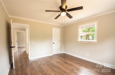 Updated water view home with a full basement, located less than on Piney Point Golf Club in North Carolina - for sale on GolfHomes.com, golf home, golf lot