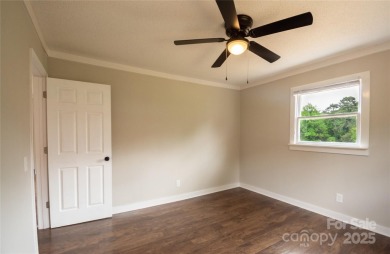 Updated water view home with a full basement, located less than on Piney Point Golf Club in North Carolina - for sale on GolfHomes.com, golf home, golf lot