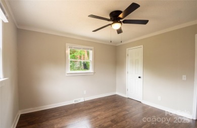 Updated water view home with a full basement, located less than on Piney Point Golf Club in North Carolina - for sale on GolfHomes.com, golf home, golf lot