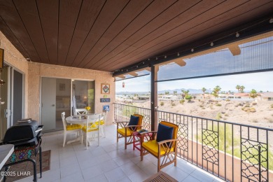 Wake up to peaceful lake views and vibrant sunsets at 565 Jones on London Bridge Golf Course in Arizona - for sale on GolfHomes.com, golf home, golf lot