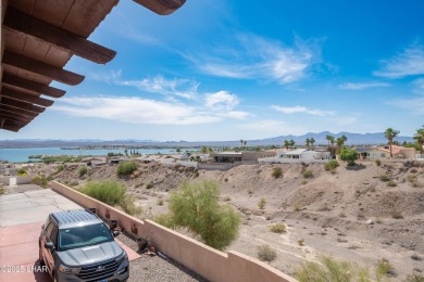 Wake up to peaceful lake views and vibrant sunsets at 565 Jones on London Bridge Golf Course in Arizona - for sale on GolfHomes.com, golf home, golf lot