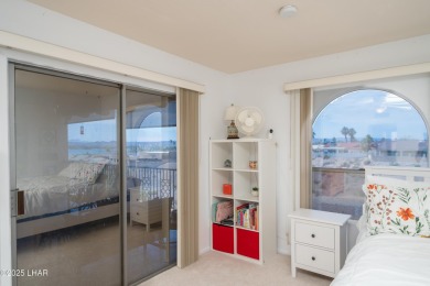 Wake up to peaceful lake views and vibrant sunsets at 565 Jones on London Bridge Golf Course in Arizona - for sale on GolfHomes.com, golf home, golf lot