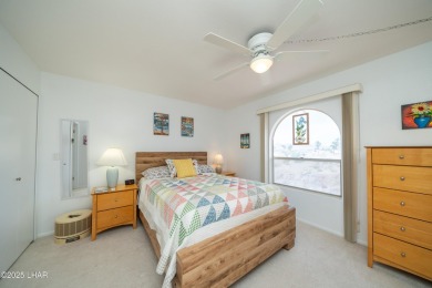 Wake up to peaceful lake views and vibrant sunsets at 565 Jones on London Bridge Golf Course in Arizona - for sale on GolfHomes.com, golf home, golf lot