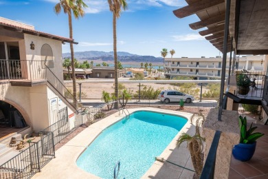 Wake up to peaceful lake views and vibrant sunsets at 565 Jones on London Bridge Golf Course in Arizona - for sale on GolfHomes.com, golf home, golf lot