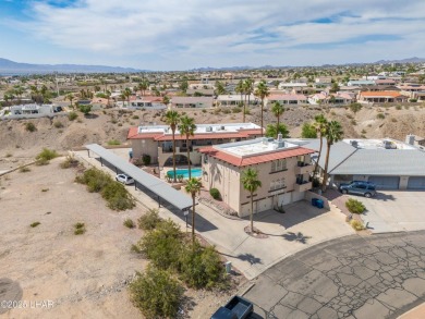 Wake up to peaceful lake views and vibrant sunsets at 565 Jones on London Bridge Golf Course in Arizona - for sale on GolfHomes.com, golf home, golf lot