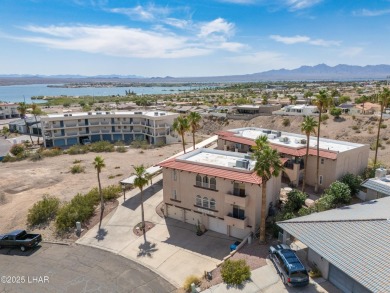 Wake up to peaceful lake views and vibrant sunsets at 565 Jones on London Bridge Golf Course in Arizona - for sale on GolfHomes.com, golf home, golf lot