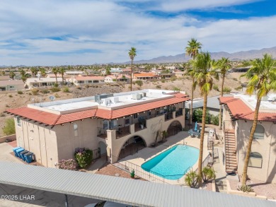 Wake up to peaceful lake views and vibrant sunsets at 565 Jones on London Bridge Golf Course in Arizona - for sale on GolfHomes.com, golf home, golf lot