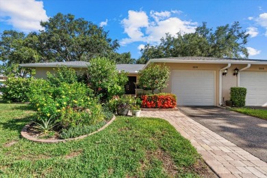 This beautifully renovated villa on a desirable corner lot in on Palm Aire Country Club of Sarasota in Florida - for sale on GolfHomes.com, golf home, golf lot