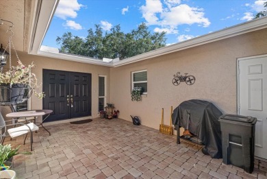 This beautifully renovated villa on a desirable corner lot in on Palm Aire Country Club of Sarasota in Florida - for sale on GolfHomes.com, golf home, golf lot
