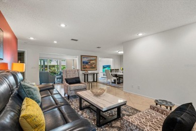 This beautifully renovated villa on a desirable corner lot in on Palm Aire Country Club of Sarasota in Florida - for sale on GolfHomes.com, golf home, golf lot