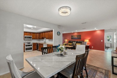 This beautifully renovated villa on a desirable corner lot in on Palm Aire Country Club of Sarasota in Florida - for sale on GolfHomes.com, golf home, golf lot