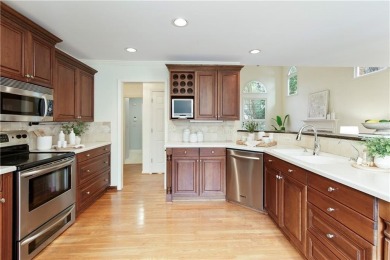 Nestled in the charming Spinnakers of Windward, an intimate on The Golf Club of Georgia in Georgia - for sale on GolfHomes.com, golf home, golf lot