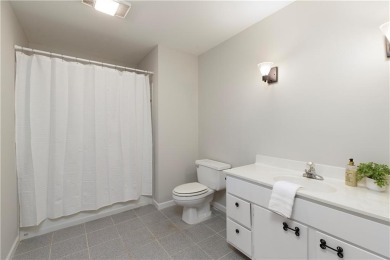 Nestled in the charming Spinnakers of Windward, an intimate on The Golf Club of Georgia in Georgia - for sale on GolfHomes.com, golf home, golf lot