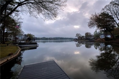 Nestled in the charming Spinnakers of Windward, an intimate on The Golf Club of Georgia in Georgia - for sale on GolfHomes.com, golf home, golf lot