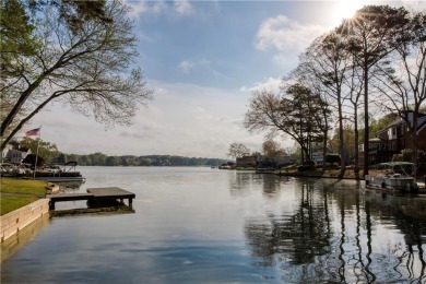 Nestled in the charming Spinnakers of Windward, an intimate on The Golf Club of Georgia in Georgia - for sale on GolfHomes.com, golf home, golf lot