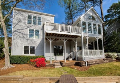 Nestled in the charming Spinnakers of Windward, an intimate on The Golf Club of Georgia in Georgia - for sale on GolfHomes.com, golf home, golf lot