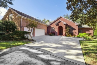 Step into luxury at this beautifully updated brick Pool home on Jacksonville Golf and Country Club in Florida - for sale on GolfHomes.com, golf home, golf lot