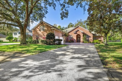 Step into luxury at this beautifully updated brick Pool home on Jacksonville Golf and Country Club in Florida - for sale on GolfHomes.com, golf home, golf lot