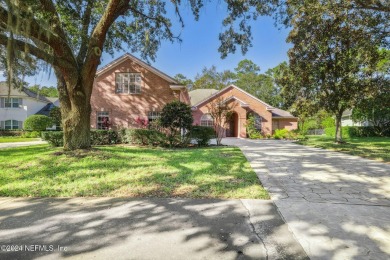 Step into luxury at this beautifully updated brick Pool home on Jacksonville Golf and Country Club in Florida - for sale on GolfHomes.com, golf home, golf lot