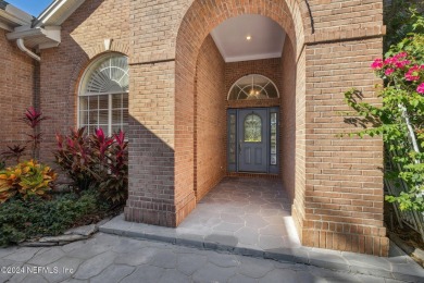 Step into luxury at this beautifully updated brick Pool home on Jacksonville Golf and Country Club in Florida - for sale on GolfHomes.com, golf home, golf lot