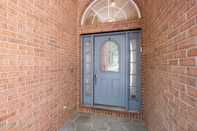 Step into luxury at this beautifully updated brick Pool home on Jacksonville Golf and Country Club in Florida - for sale on GolfHomes.com, golf home, golf lot