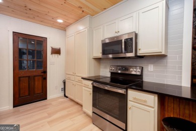 Nestled on a desirable corner lot near the North Gate, this on The Highlands Course at Lake Arrowhead in Georgia - for sale on GolfHomes.com, golf home, golf lot