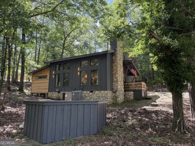Nestled on a desirable corner lot near the North Gate, this on The Highlands Course at Lake Arrowhead in Georgia - for sale on GolfHomes.com, golf home, golf lot