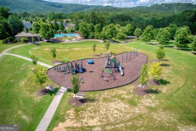 Nestled on a desirable corner lot near the North Gate, this on The Highlands Course at Lake Arrowhead in Georgia - for sale on GolfHomes.com, golf home, golf lot