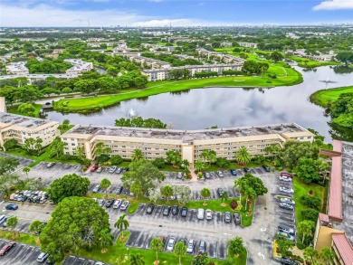 Exquisite water view 2 bed/2 bath unit. No assesments/40 Yr DONE on Wynmoor Golf Course in Florida - for sale on GolfHomes.com, golf home, golf lot