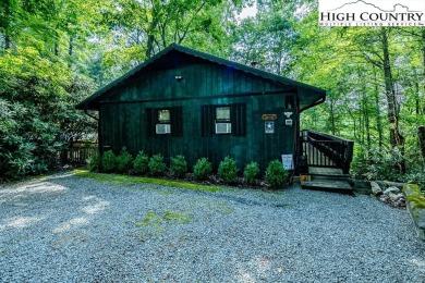 Cute Year Round Mountain Cabin.  Open floor plan with fantastic on Land Harbor Golf Course in North Carolina - for sale on GolfHomes.com, golf home, golf lot