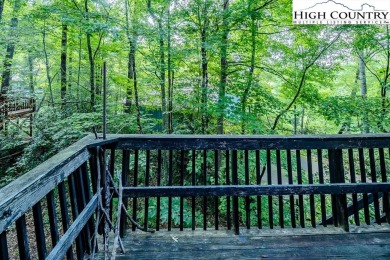 Cute Year Round Mountain Cabin.  Open floor plan with fantastic on Land Harbor Golf Course in North Carolina - for sale on GolfHomes.com, golf home, golf lot