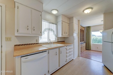 Discover comfort, convenience, and resort-style living in this on Sun Lakes Country Club in Arizona - for sale on GolfHomes.com, golf home, golf lot