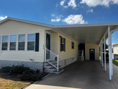 Beautiful 2009 home is just under 1700 sf. and sits on the 9th on Lake Henry Golf Club in Florida - for sale on GolfHomes.com, golf home, golf lot