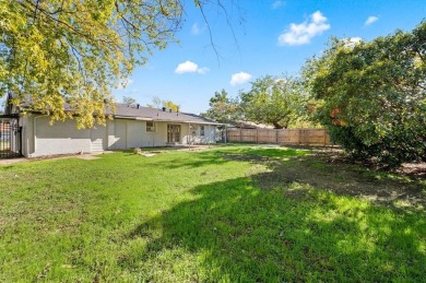 Set in the Valwood Park subdivision of Farmers Branch, this on Brookhaven Country Club - Golf Course in Texas - for sale on GolfHomes.com, golf home, golf lot