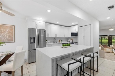 Wake up to soft morning light and tranquil lake views in this on Boca Lago Golf and Country Club in Florida - for sale on GolfHomes.com, golf home, golf lot